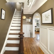 View of a staircase which features timber steps, ceiling, daylighting, dining room, floor, flooring, hall, handrail, hardwood, home, interior design, laminate flooring, molding, real estate, room, stairs, wall, wood, wood flooring, wood stain, white, brown