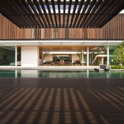 View of home designed by Wallflower Architecture &amp; architecture, condominium, courtyard, daylighting, estate, floor, flooring, hardwood, house, interior design, lobby, property, real estate, swimming pool, wood, black