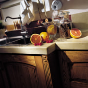 View of a contemporary kitchen which features countertops countertop, furniture, interior design, kitchen, room, table, black