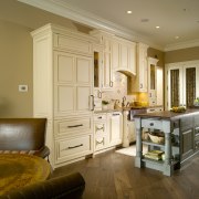 View of the refurbished kitchen featuring a more cabinetry, ceiling, countertop, cuisine classique, floor, flooring, hardwood, home, interior design, kitchen, living room, room, wall, window, wood flooring, brown, orange