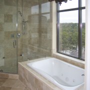 View of the condominium bathroom before renovation. bathroom, bathtub, floor, flooring, home, interior design, plumbing fixture, property, room, tile, wall, window, gray