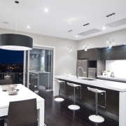 View of the kitchen and dining area of countertop, interior design, kitchen, real estate, room, white, black