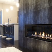 interior view of the New David Reid show fireplace, hearth, interior design, wood burning stove, black