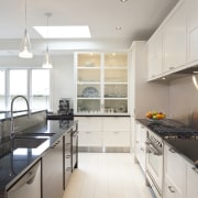 This renovated kitchen features indian black granite benchtops, cabinetry, countertop, cuisine classique, floor, interior design, kitchen, property, real estate, room, gray