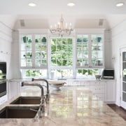 A view of a kitchen by Julie Hacker ceiling, countertop, estate, floor, flooring, home, interior design, kitchen, property, real estate, room, window, gray, white