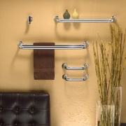 View of a bathroom which features stainless steel bathroom, furniture, metal, plumbing fixture, product design, shelf, shelving, tap, wall, orange