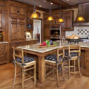 A view of a kitchen by Bruce Kading cabinetry, countertop, cuisine classique, dining room, flooring, furniture, hardwood, interior design, kitchen, room, table, wood, wood flooring, brown