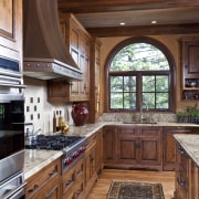 A view of a kitchen by Bruce Kading cabinetry, ceiling, countertop, cuisine classique, estate, flooring, hardwood, home, interior design, kitchen, real estate, room, window, wood, wood flooring, wood stain, brown