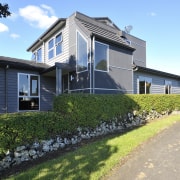 Exterior view of a home built by Keola building, cottage, elevation, estate, facade, farmhouse, home, house, neighbourhood, property, real estate, residential area, sky, villa