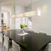 View of a condominium dining area which features countertop, dining room, interior design, kitchen, product design, room, table, gray