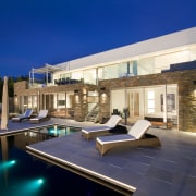 Exterior view of house designed by Graham Jones apartment, architecture, backyard, condominium, estate, home, house, lighting, penthouse apartment, property, real estate, residential area, sky, swimming pool, villa, blue