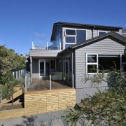 Exterior view of a home built by Keola architecture, building, cottage, elevation, estate, facade, home, house, property, real estate, residential area, roof, siding, window, blue