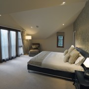 Interior bedroom view of a remodelled house. Designed architecture, bedroom, ceiling, estate, floor, home, interior design, property, real estate, room, suite, wall, window, brown, gray