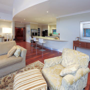 Exterior lounge view of a remodelled house. Designed estate, floor, flooring, home, interior design, living room, property, real estate, room, suite, gray