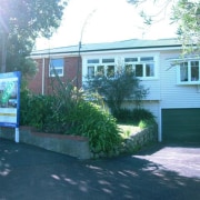 View of the house prior to renovation. - cottage, home, house, neighbourhood, property, real estate, residential area, siding, tree, window, yard, teal
