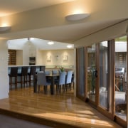 interior kitchen/Dinning area view of a residence which ceiling, floor, flooring, interior design, real estate, room, brown, gray