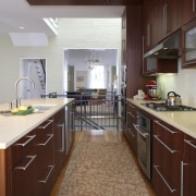 View of a kitchen which features limestone countertops, cabinetry, ceiling, countertop, cuisine classique, floor, flooring, hardwood, home, interior design, kitchen, room, wood flooring, red, gray