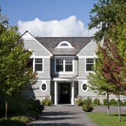 View of the homes exterior featuring stained cider architecture, building, cottage, estate, facade, home, house, mansion, neighbourhood, plant, property, real estate, residential area, suburb, tree, brown