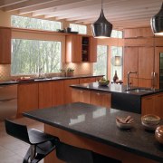 View of a contemporary kitchen which features countertops cabinetry, countertop, cuisine classique, interior design, kitchen, room, brown