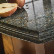 View of a contemporary kitchen which features countertops wood, wood stain, brown, black, gray