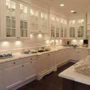 A view of a kitchen by Downsview Features cabinetry, countertop, cuisine classique, floor, flooring, home, interior design, kitchen, room, under cabinet lighting, window, orange, brown