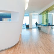 The new Zain headquarters in Bahrain reflects the floor, flooring, furniture, interior design, product design, gray, white