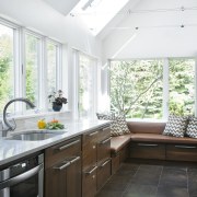 View of a kitchen which features white quartzite cabinetry, ceiling, countertop, cuisine classique, daylighting, floor, home, house, interior design, kitchen, real estate, room, window, white