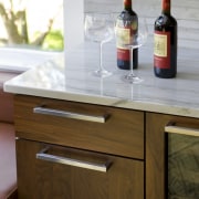 View of a kitchen which features white quartzite chest of drawers, drawer, furniture, product design, table, wood stain, brown, gray