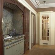 View of hand-built Lacanche French ranges offered by cabinetry, ceiling, door, estate, floor, flooring, hardwood, home, interior design, molding, real estate, wall, window, wood stain, brown