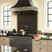 View of hand-built Lacanche French ranges offered by cabinetry, countertop, cuisine classique, home appliance, interior design, kitchen, kitchen appliance, kitchen stove, room, black, yellow