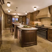 View of hand-built Lacanche French ranges offered by cabinetry, countertop, cuisine classique, interior design, kitchen, room, brown, orange