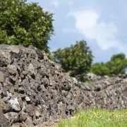 View of Mt Wellington stone walls. - View bedrock, geology, grass, landscape, outcrop, rock, sky, soil, stone wall, tree, wall, gray, teal