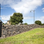 View of Mt Wellington stone walls. - View cloud, grass, land lot, landscape, real estate, road, rural area, sky, tree, wall, white