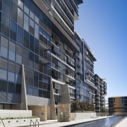 Good things come in threes. The new Trio apartment, architecture, building, commercial building, condominium, corporate headquarters, daytime, facade, headquarters, mixed use, real estate, reflection, residential area, sky, window