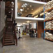 View of the new Mojo Coffee Holdings headquarters floor, flooring, interior design, lobby, warehouse, wood, gray