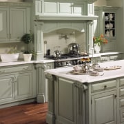 This kitchen features compartmentalized storage solutions.This kitchen features cabinetry, countertop, cuisine classique, floor, home appliance, interior design, kitchen, kitchen appliance, kitchen stove, room, sink, brown