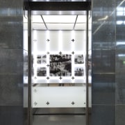 View of a Compass destination entry system from display case, glass, black, gray