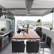 The commercial look of the kitchen is reinforced countertop, house, interior design, kitchen, patio, real estate, roof, white, gray