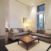 View of one of the 14 new residences ceiling, floor, home, interior design, living room, property, real estate, room, suite, table, gray