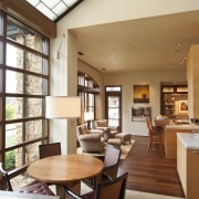 he light-filled linking elements are defined by translucent ceiling, interior design, living room, real estate, table, window, brown, white