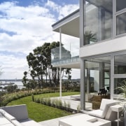 View of a large apartment development in Auckland apartment, architecture, building, condominium, estate, home, house, mixed use, outdoor furniture, property, real estate, residential area, sunlounger, white, gray