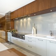 View of kitchen featuring teak cabinetry, Gaggenau oven cabinetry, countertop, cuisine classique, home, interior design, kitchen, real estate, room, brown, white, gray
