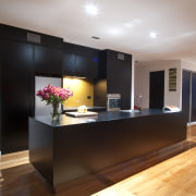 This new kitchen designed by Nicola Mason of cabinetry, ceiling, countertop, floor, flooring, hardwood, interior design, kitchen, real estate, room, wood flooring, black, gray