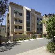 View of the new Linfield Apartments- a modern apartment, architecture, building, condominium, elevation, estate, facade, home, house, mixed use, neighbourhood, property, real estate, residential area, window, gray
