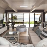 View of renovated beach house with interior design house, interior design, living room, property, real estate, gray