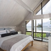 View of renovated beach house with interior design architecture, bed frame, bedroom, ceiling, daylighting, estate, floor, home, house, interior design, real estate, wood, wood flooring, gray