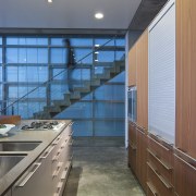 View of kitchen featuring walnut cabinetry, caesarstone bench architecture, ceiling, countertop, daylighting, glass, house, interior design, kitchen, real estate, wall, gray