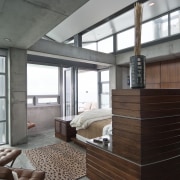 View of the master bedroom featuring concrete floors, architecture, furniture, house, interior design, window, gray, black, white