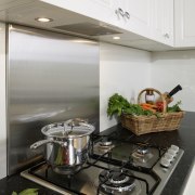 With a fully integrated kitchen design, appliances are cookware and bakeware, countertop, interior design, kitchen, white, gray