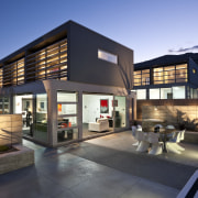 View of the homes exterior featuring plaster and apartment, architecture, building, facade, home, house, mixed use, property, real estate, residential area, black